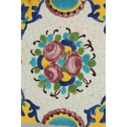 300 - A 19TH CENTURY PERSIAN GLAZED POTTERY TILE, 20cm square.