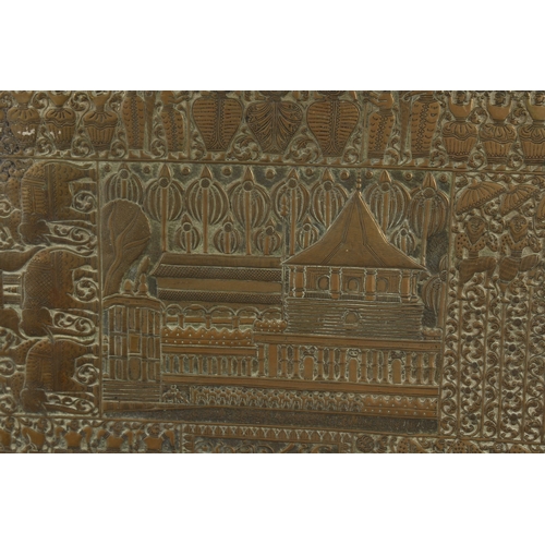 303 - A LARGE INDIAN EMBOSSED AND CHASED BRASS RECTANGULAR TRAY, 51cm x 61cm.