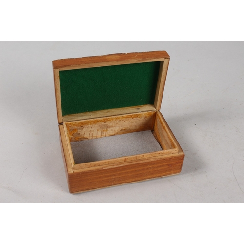 308 - AN AMBER INSET WOODEN BOX, 14cm x 9cm.