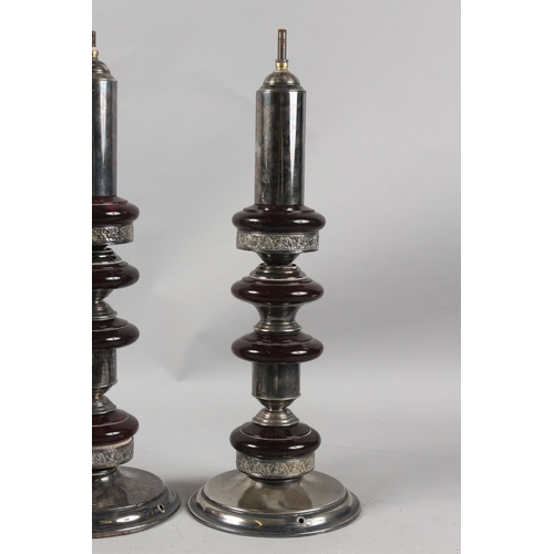 315 - A VERY FINE PAIR OF CIRCULAR PLATED TABLE LAMP BASES, the columns inserted with possibly bakelite or... 