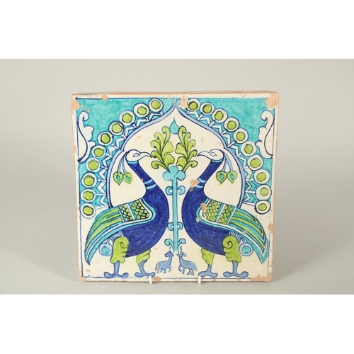 326 - AN UNUSUAL 19TH CENTURY NORTH INDIAN MULTAN GLAZED POTTERY TILE, depicting two peacocks, 30cm x 30.5... 