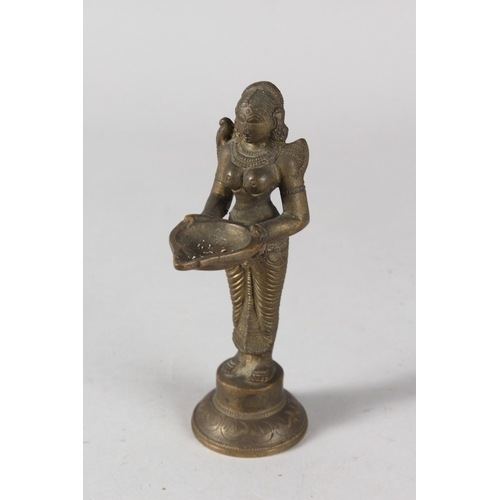 33 - AN INDIAN BRONZE DEITY FIGURAL OIL LAMP, 15cm high.