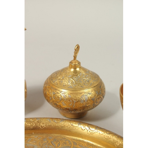 337 - A FINE 19TH-20TH CENTURY OTTOMAN TURKISH GILT COPPER TOMBAK COFFEE SET, tray 21cm diameter.