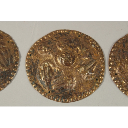 339 - A COLLECTION OF THREE 18TH-19TH CENTURY OTTOMAN ARMENIAN GILT COPPER CIRCULAR PLAQUES, depicting ang... 