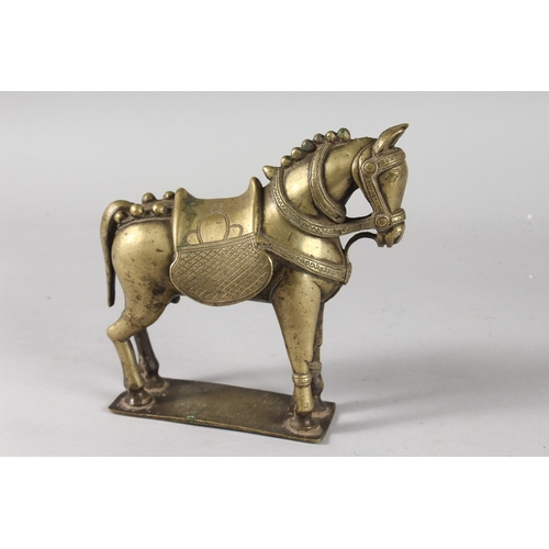 35 - AN INDIAN BRASS FIGURE OF A HORSE, 19cm long.