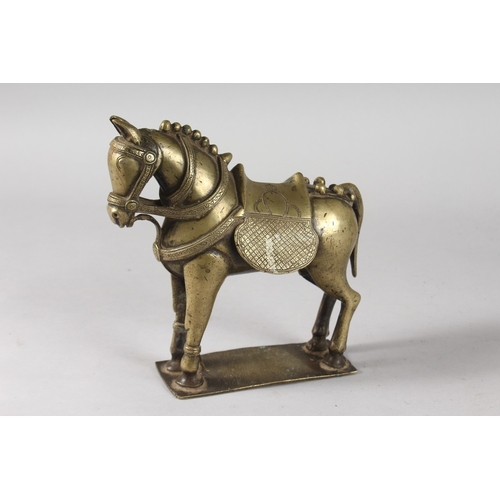 35 - AN INDIAN BRASS FIGURE OF A HORSE, 19cm long.