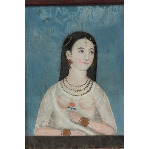 36 - A FINE INDIAN PORTRAIT PAINTING, possibly on mica, framed and glazed, 30.5cm x 24.5cm overall.