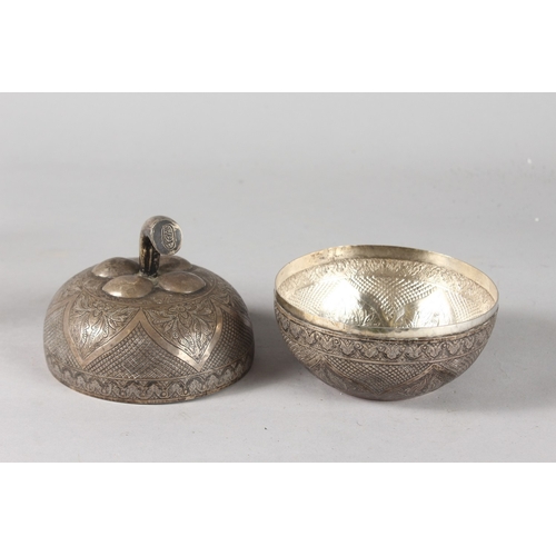 37 - A BRUNEI BORNEO MALAY ENGRAVED SILVER APPLE SHAPED LIDDED BOX, signed to stalk, 14cm high, 12cm wide... 