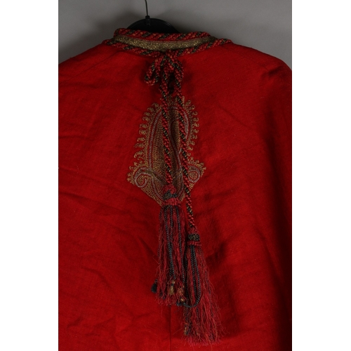 389 - AN INDIAN KASHMIR EMBROIDERED DRESS COAT, with paisley designs and quilted satin lining, bearing sti... 