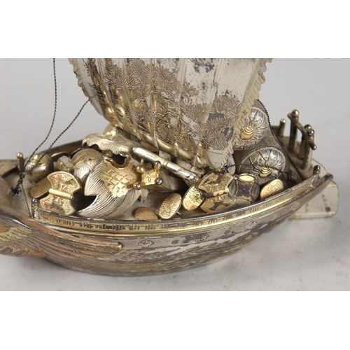 393 - A JAPANESE SILVER MODEL OF A BOAT, 15.5cm high.