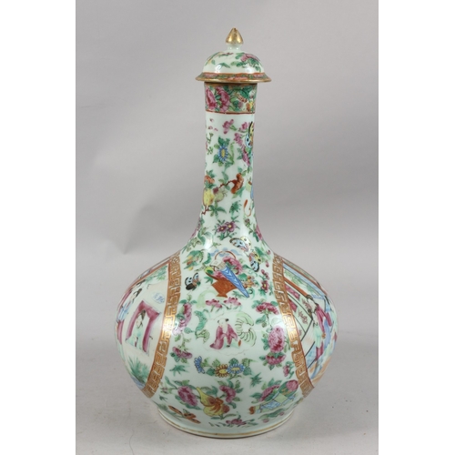 395 - A CHINESE CANTON FAMILLE ROSE PORCELAIN LIDDED VASE, painted with panels of figures as well as preci... 