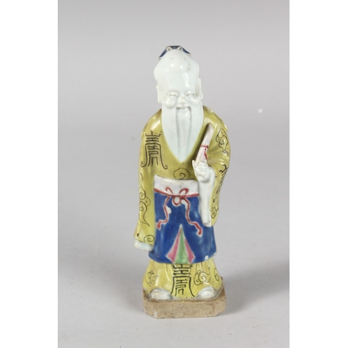 4 - A 19TH CENTURY CHINESE POLYCHROME GLAZED POTTERY FIGURE OF A SAGE, 19cm high.