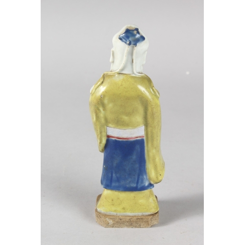 4 - A 19TH CENTURY CHINESE POLYCHROME GLAZED POTTERY FIGURE OF A SAGE, 19cm high.