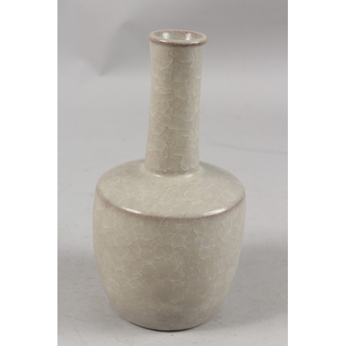 404 - A CHINESE CRACKLE GLAZE POTTERY BOTTLE VASE, 22cm high.