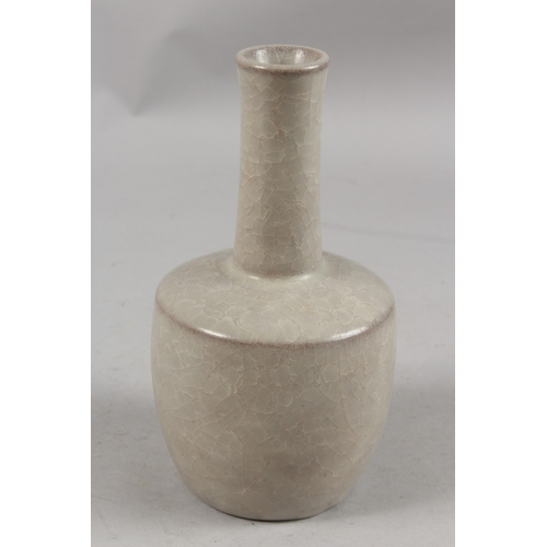 404 - A CHINESE CRACKLE GLAZE POTTERY BOTTLE VASE, 22cm high.