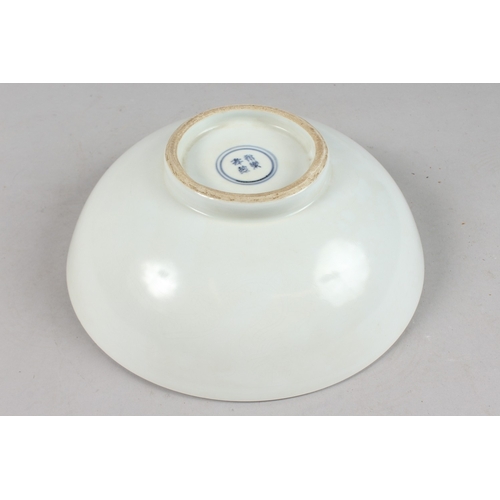 405 - A LARGE CHINESE WHITE GLAZE PORCELAIN BOWL, with character mark to base, 28cm diameter.