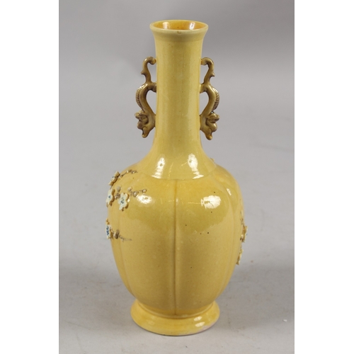 408 - A CHINESE QING DYNASTY YELLOW GROUND PORCELAIN VASE, with carved relief prunus blossom and ornate dr... 