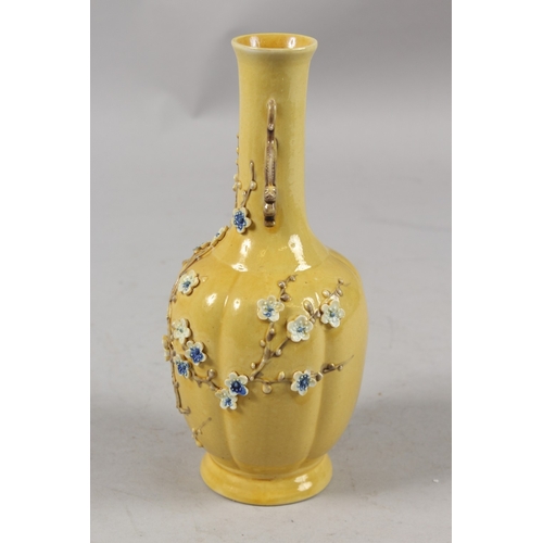 408 - A CHINESE QING DYNASTY YELLOW GROUND PORCELAIN VASE, with carved relief prunus blossom and ornate dr... 