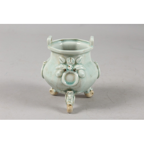 412 - A CHINESE YING CHING GLAZE POTTERY TRIPOD CENSER, with moulded and carved relief decoration, togethe... 