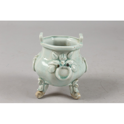 412 - A CHINESE YING CHING GLAZE POTTERY TRIPOD CENSER, with moulded and carved relief decoration, togethe... 