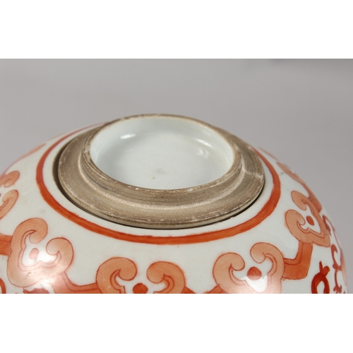 413 - A CHINESE CORAL RED AND WHITE PORCELAIN TALL GINGER JAR AND COVER, 26cm high.