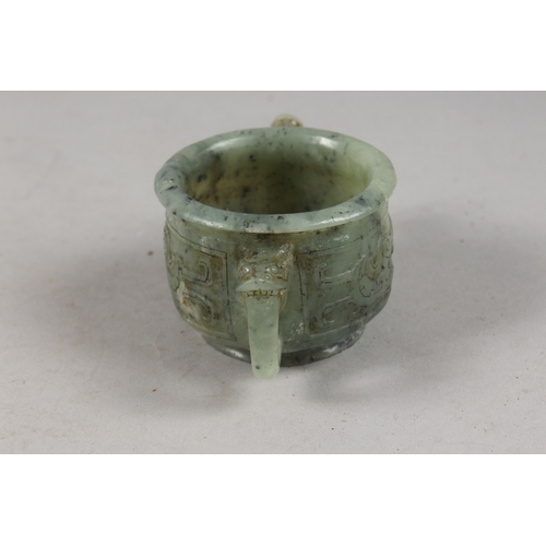 417 - A FINE CHINESE CARVED JADE TWIN HANDLE CENSER, with archaic designs, applied collection sticker to b... 