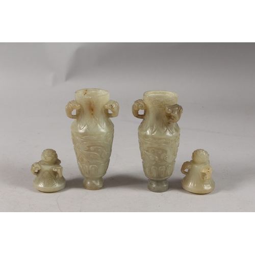 418 - A PAIR OF CHINESE CARVED JADE LIDDED VASES, each with three ring handles to the neck and carved with... 