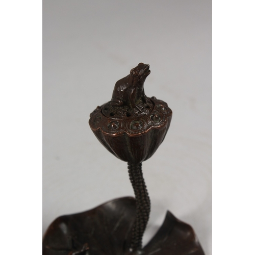 430 - A BRONZE OKIMONO OF A FROG ON A LILY PAD WITH LOTUS.