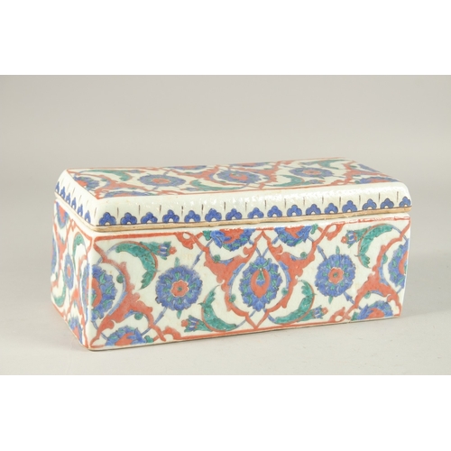 441 - A TURKISH IZNIK GLAZED POTTERY RECTANGLAR LIDDED BOX, 28cm long.