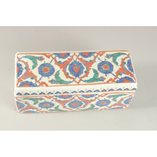 441 - A TURKISH IZNIK GLAZED POTTERY RECTANGLAR LIDDED BOX, 28cm long.