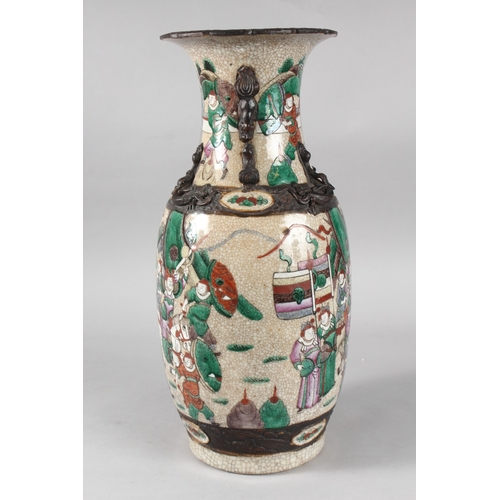 6 - A 19TH CENTURY CHINESE CRACKLE GLAZE PORCELAIN VASE, painted with warriors, the neck with moulded ha... 