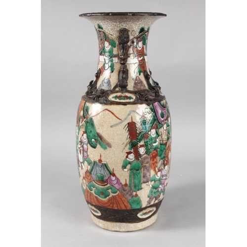 6 - A 19TH CENTURY CHINESE CRACKLE GLAZE PORCELAIN VASE, painted with warriors, the neck with moulded ha... 