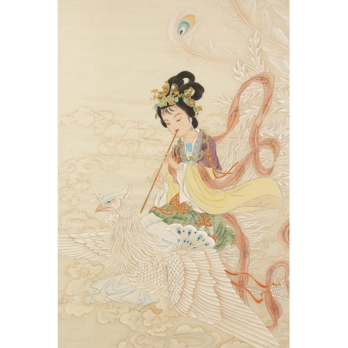 71 - A LARGE CHINESE PAINTING ON SILK, depicting a fluting female figure atop a mythical bird / phoenix, ... 