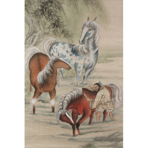 76 - A LARGE CHINESE PAINTING ON SILK, depicting horses being groomed, inscribed and bearing red seal mar... 