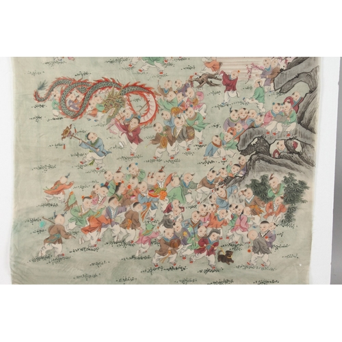 77 - A LARGE CHINESE PAINTING ON SILK, depicting one hundred boys at play, inscribed and bearing red seal... 