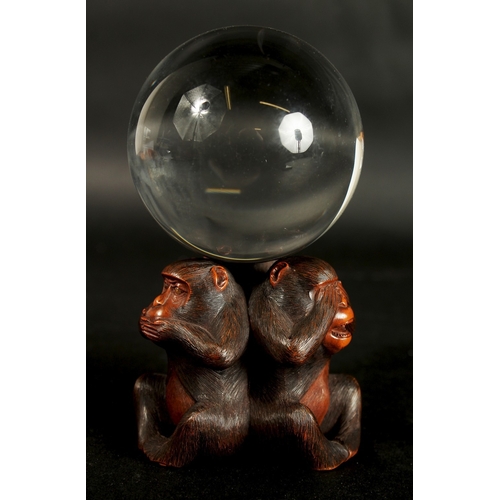 86 - A VERY FINE JAPANESE CARVED WOOD OKIMONO OF THREE WISE MONKEYS WITH GLASS BALL, in the manner of Mas... 