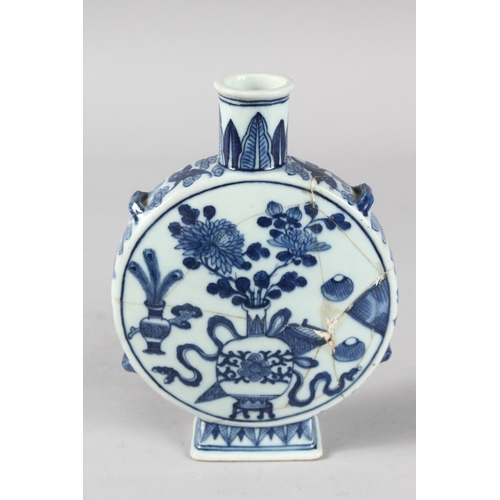 95 - AN 18TH-19TH CENTURY CHINESE BLUE AND WHITE PORCELAIN MOON FLASK, painted with a central vase of flo... 