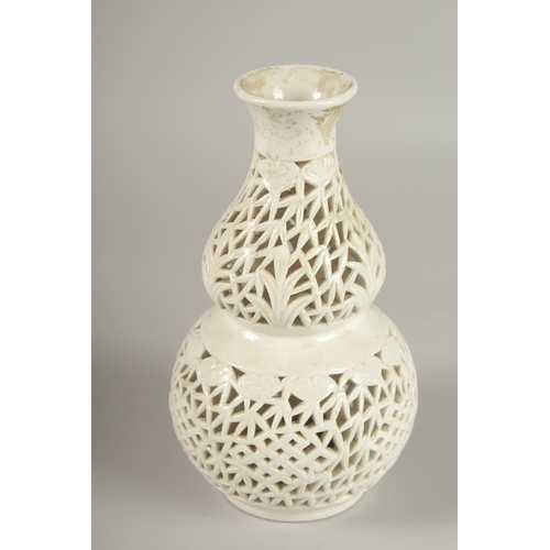 97 - A CHINESE PIERCED PORCELAIN DOUBLE GOURD VASE, 20.5cm high.