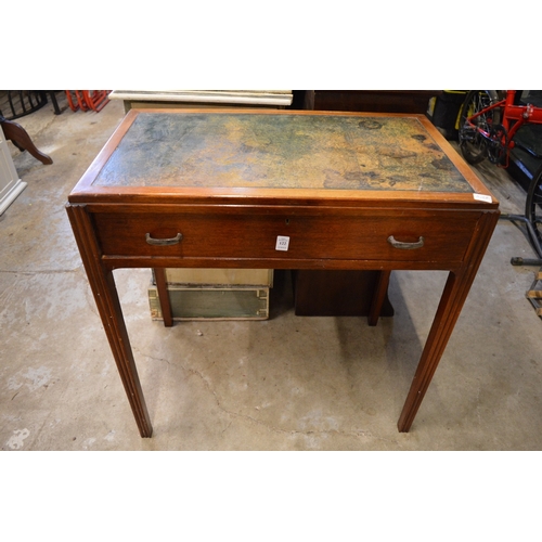 122 - A mahogany writing table.