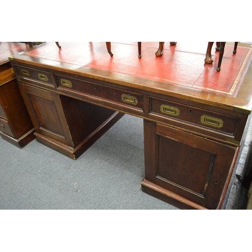 221 - A military style mahogany twin pedestal partners desk.