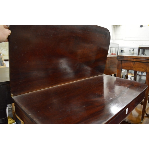 222 - A 19th century mahogany fold-over tea table on pedestal base.