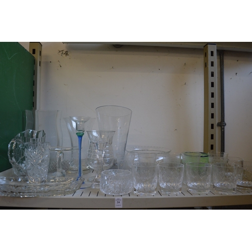 24 - A quantity of glassware to include jugs, vases etc.