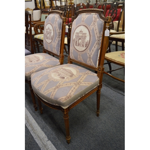 240 - A pair of French style walnut framed side chairs with upholstered backs and seats in a classical sty... 