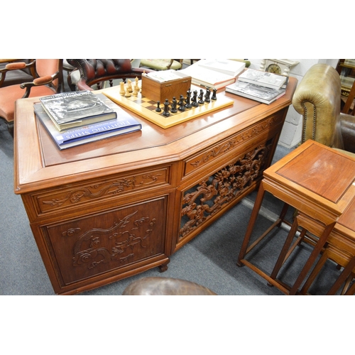 254 - A large Chinese hardwood twin pedestal desk.