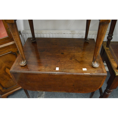 306 - A George III mahogany and rosewood banded Pembroke table.