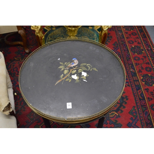 320 - A Victorian ebonised and ormolu mounted circular occasional table with an inlaid Ashby slate top.