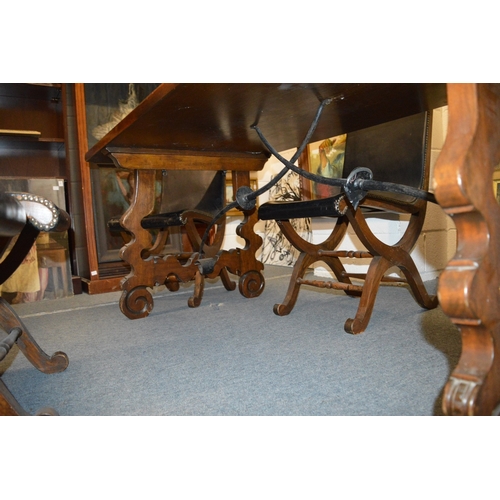 327 - A good Spanish baroque style walnut dining table with wrought iron stretchers.