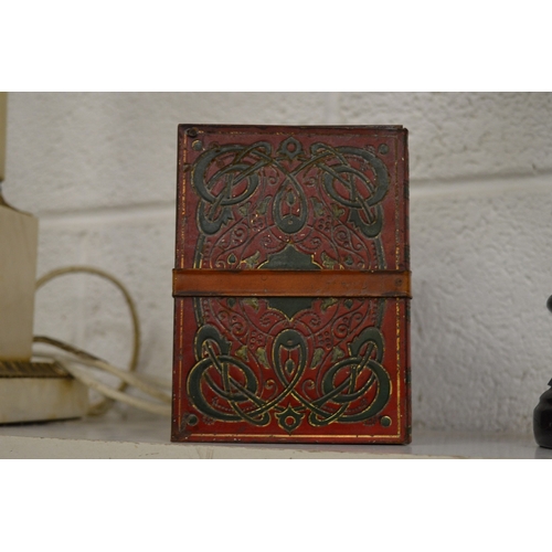 520 - A Huntley & Palmers biscuit tin in the form of a group of books held together with by a leather belt... 