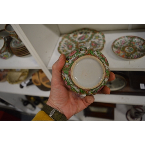 558 - A famille rose bowl and cover with similar stand and plate.