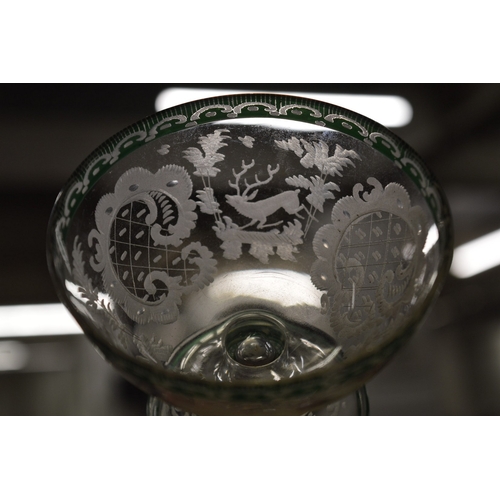 582 - A good engraved glass pedestal bowl and stand together with a pair of small cut glass bottles.